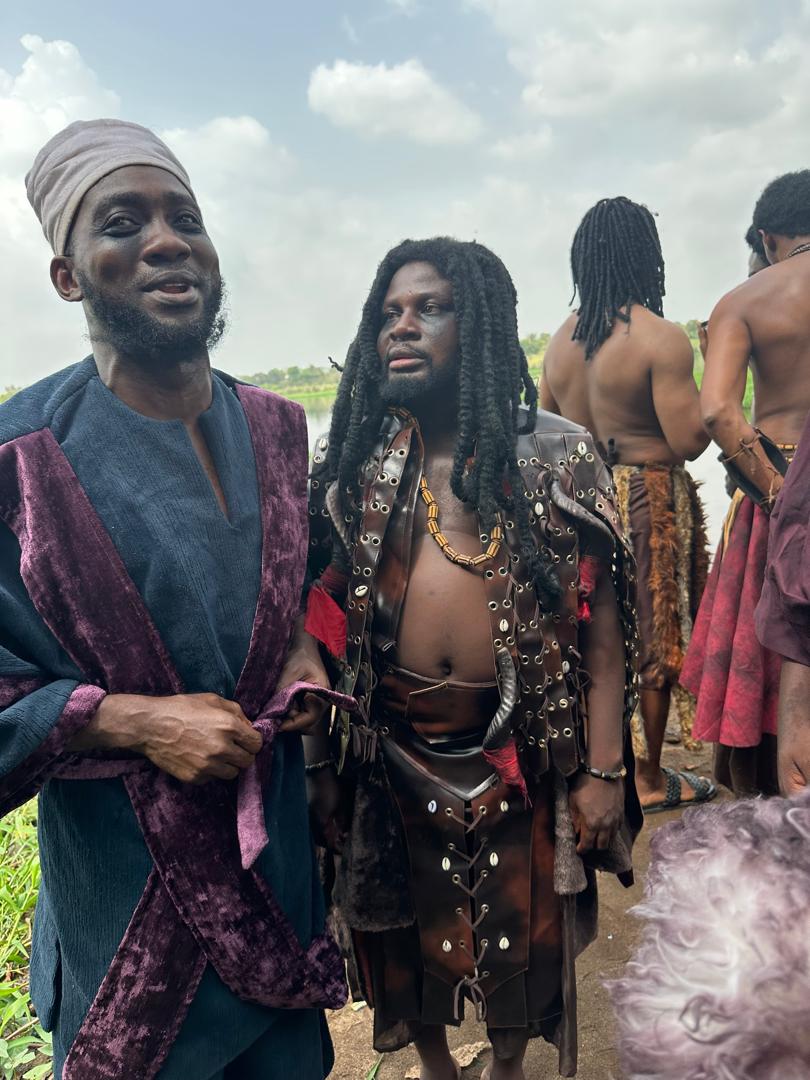 Cast members in character as a chief and a warrior on the set of Ogbomoso Elemoso